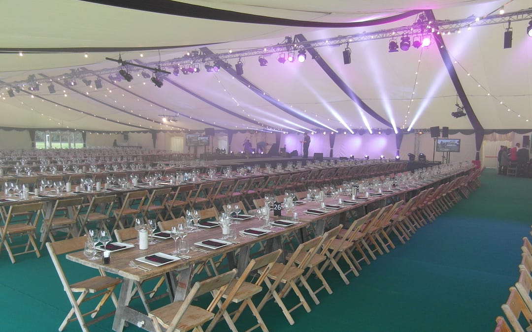 Purvis Marquees, corporate finishes, flat ivory linings, roof overlays, custom finishes, green carpet, rustic furniture, marquee lighting